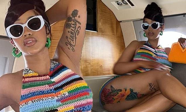 Cardi B flashes her taut abs in a colorful crop top and short set