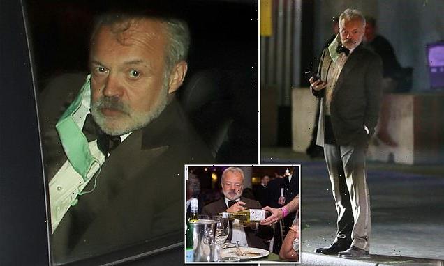 Graham Norton is pictured waiting for a taxi after BAFTA TV Awards