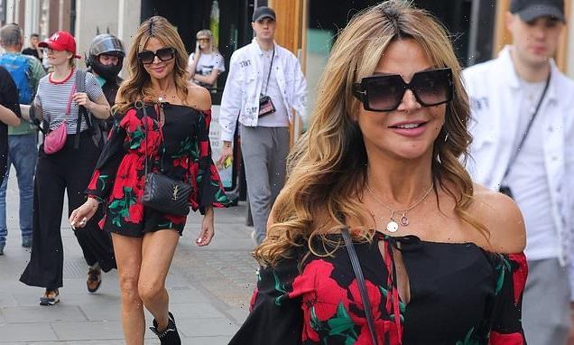 Lizzie Cundy shows off her incredible legs in a bold floral playsuit