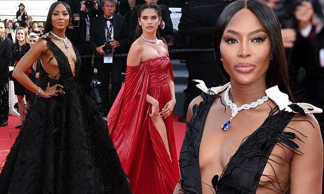 Naomi Campbell, 51, goes braless in a plunging black feathered gown