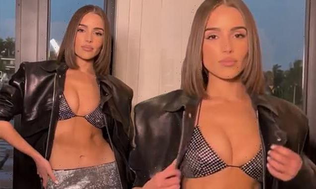 Olivia Culpo showcases her abs in a sequined bra and miniskirt