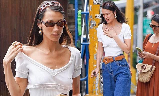 Bella Hadid shows off her tiny waist in a crop top and clogs in NYC