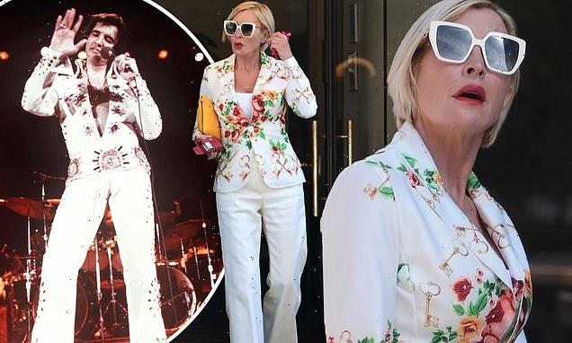 Heather Mills, 54, channels Elvis in a white flared trouser suit