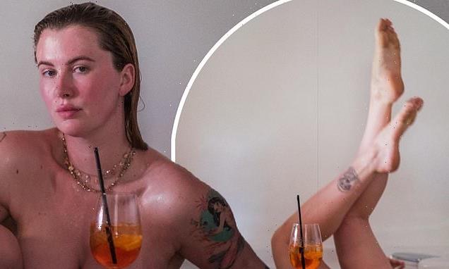 Ireland Baldwin shows off her tattoos as she poses NUDE in bathtub