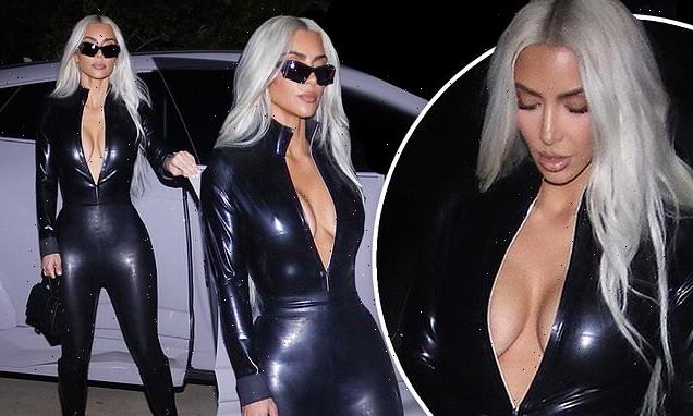 Kim Kardashian puts on a busty display in a black leather catsuit