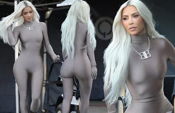 Kim shows off VERY trim waist in silver unitard after 21lb weight loss