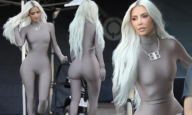 Kim shows off VERY trim waist in silver unitard after 21lb weight loss