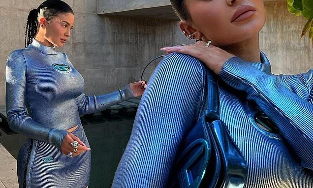 Kylie Jenner shows her curves in a metallic ribbed top and miniskirt