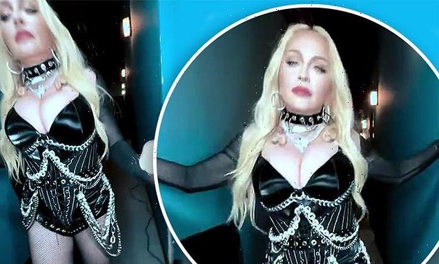 Madonna puts on VERY busty display in kinky black leather bodice