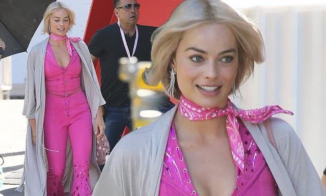 Margot Robbie dons a hot pink ensemble on the Barbie set in LA