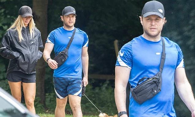 Olly Murs and new fiancée Amelia Tank step out to walk their dog