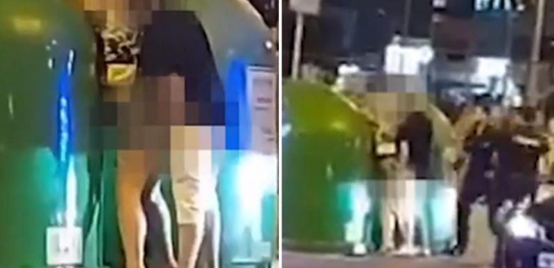 Shocking moment randy Benidorm tourists romp against a BIN before cop whacks man with a truncheon