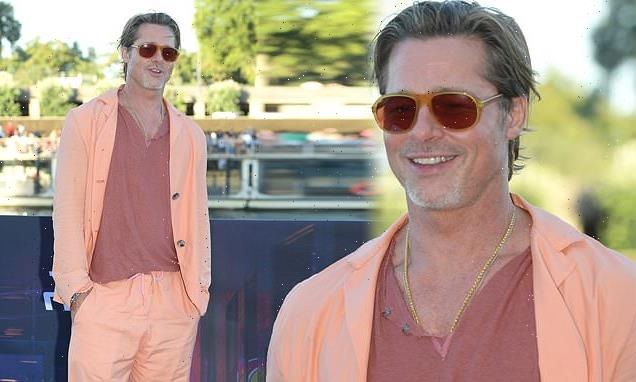 Brad Pitt puts on an eye-catching display in an orange blazer in Paris