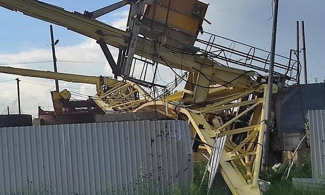 Crane operator is killed when high winds topple her 40ft crane