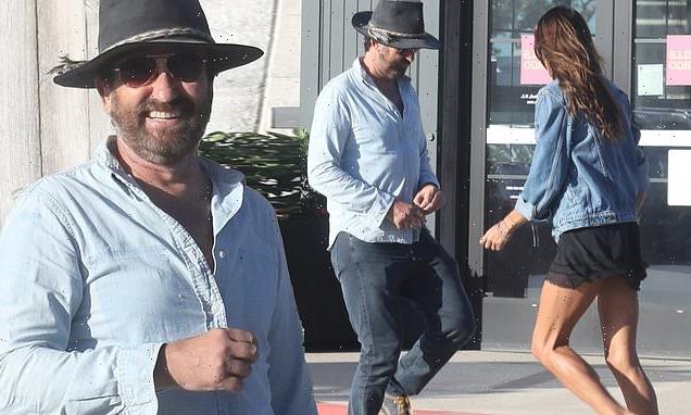 Gerard Butler and Morgan Brown show off dance moves in parking lot