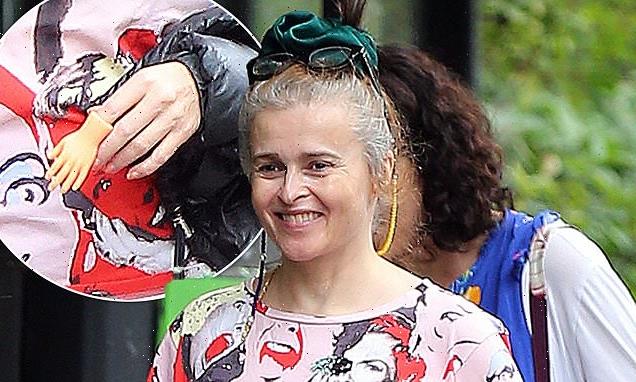Helena Bonham Carter dons a tiny hand finger puppet  for a stroll