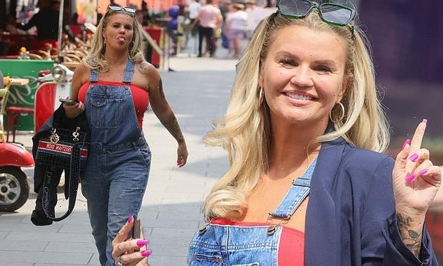 Kerry Katona stuns in dungarees and a red bandeau top at Global FM