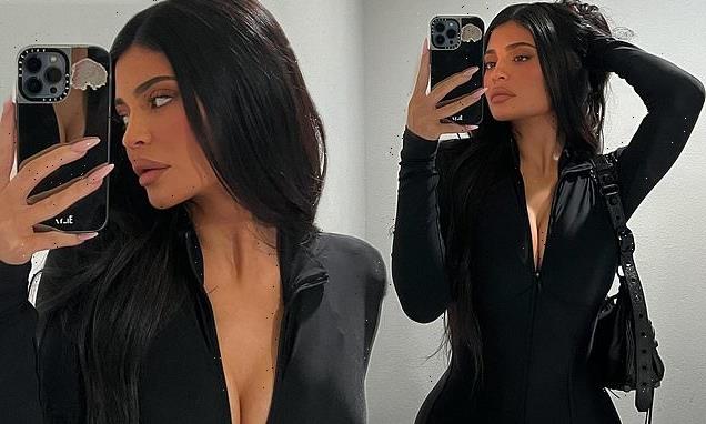 Kylie Jenner poses for mirror selfies in a plunging black catsuit