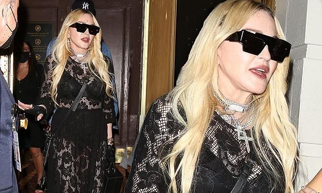 Madonna puts on a show-stopping display as she  flashes her bra