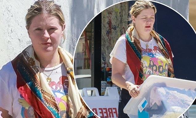 Mischa Barton drops off gently used clothing at secondhand shop