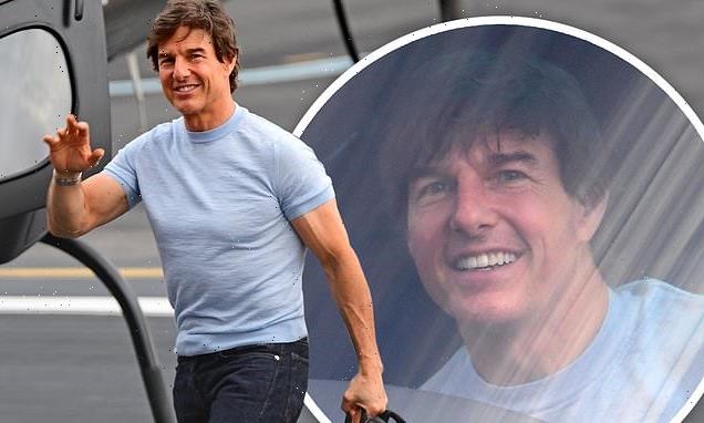 Tom Cruise offers a wave before hopping aboard his helicopter