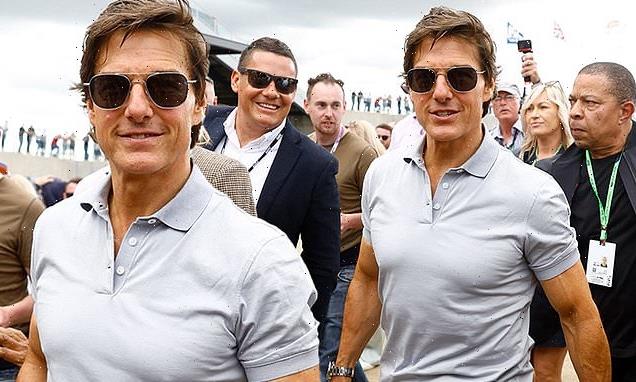 Tom Cruise puts his buff biceps on display at British Grand Prix