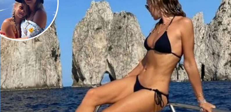 Amanda Holden shows off her incredible figure in black bikini as she lounges on a yacht | The Sun