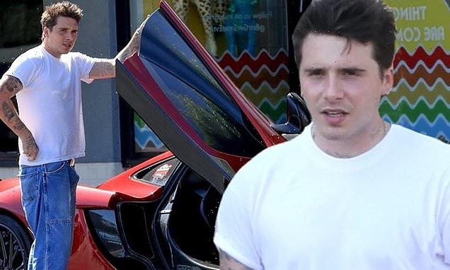 Brooklyn Beckham drives a McLaren sports car in West Hollywood