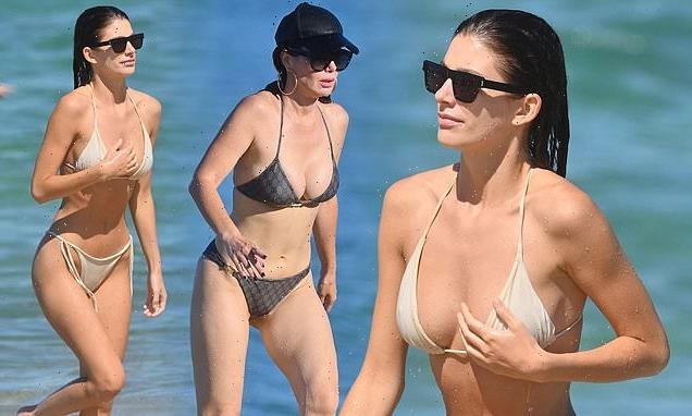Camila Morrone joins lookalike mother Lucila at the beach