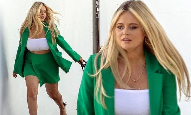 Emily Atack displays her toned legs in green shorts