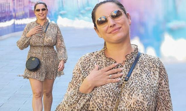 Kelly Brook flashes her legs in a playsuit as she arrives at Heart FM