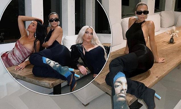 Kim Kardashian kills it in an all-black ensemble and thigh-high boots