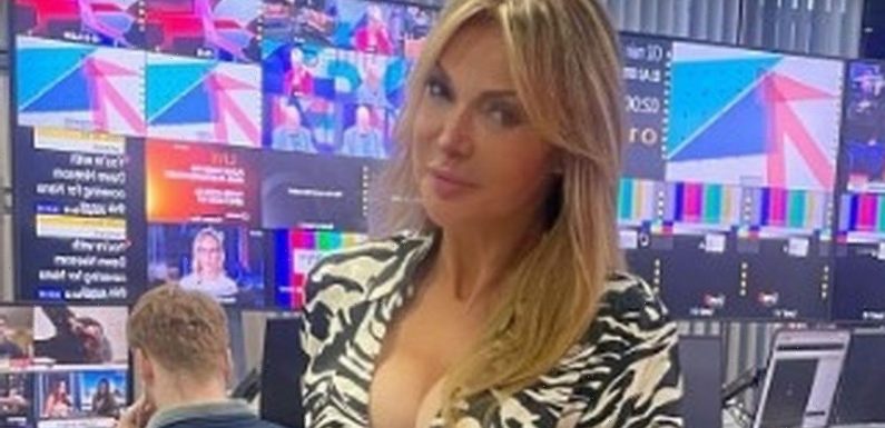 Lizzie Cundy, 54, flaunts ageless figure in thigh-skimming zebra mini dress