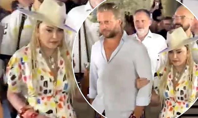 Madonna, 64, steps out for dinner with Guy Ritchie lookalike in Sicily