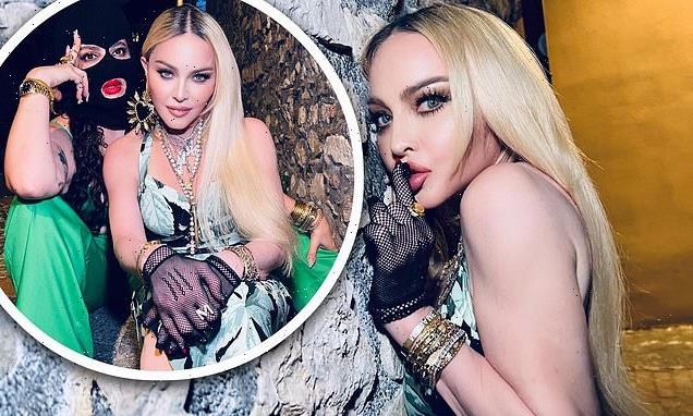 Madonna poses for sultry shots with a female pal