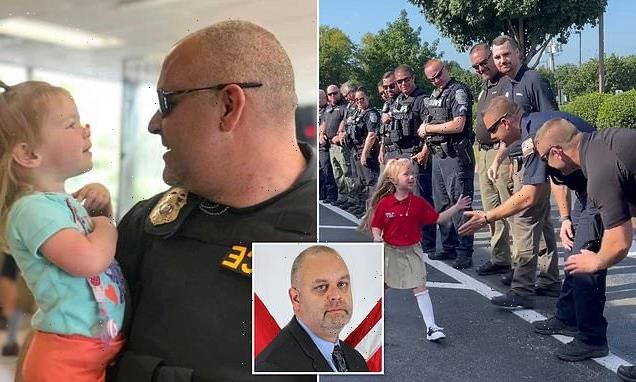 Police high-five former cop's daughter on her first day of school