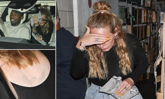 Adele shows off never-before-seen back tattoo of a bird