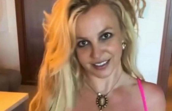 Britney Spears goes braless under sheer cut-out dress in pulse-raising display
