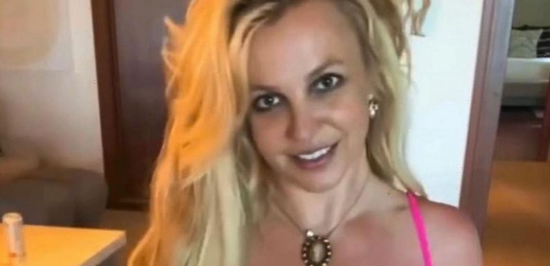 Britney Spears goes braless under sheer cut-out dress in pulse-raising display
