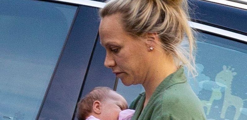 Chloe Madeley cuddles up to baby Bodhi on family day out with husband James Haskell