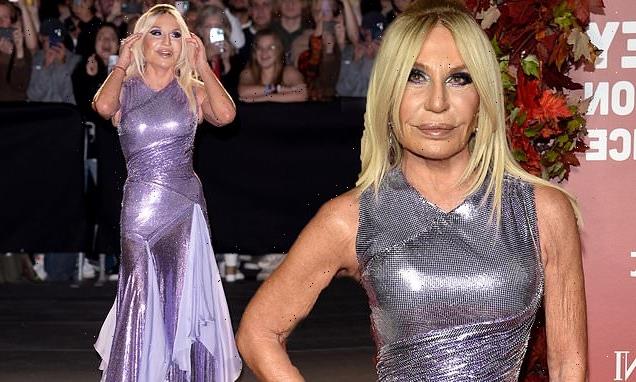 Donatella Versace stands out in an eye-catching purple gown in NYC