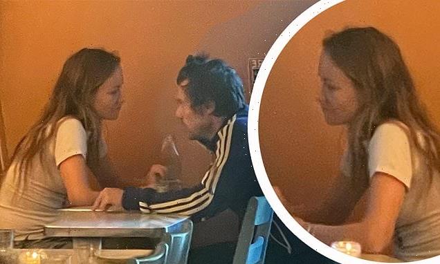 Harry, 28, and Olivia, 38, gaze into each other's eyes on dinner date