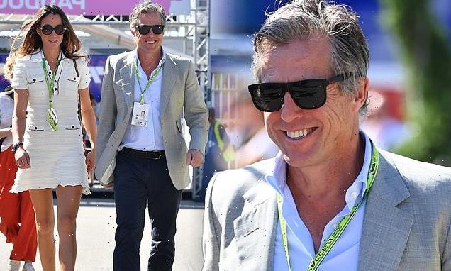 Hugh Grant is all smiles at the star-studded F1 Grand Prix in Italy