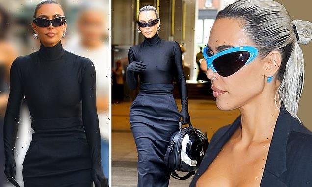 Kim Kardashian flaunts curvaceous figure in clinging all-black look