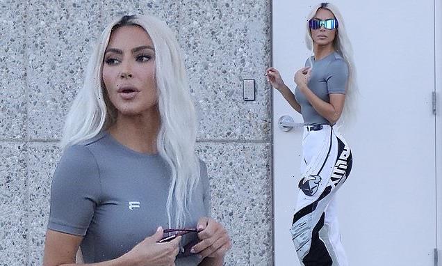 Kim Kardashian is a vision of edgy style in skintight grey top