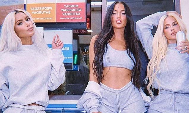 Kim Kardashian poses with her two new best friends for a SKIMS
