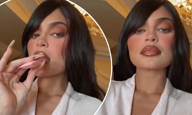 Kylie Jenner pulls her world-famous mega-pout plugging her lip gloss