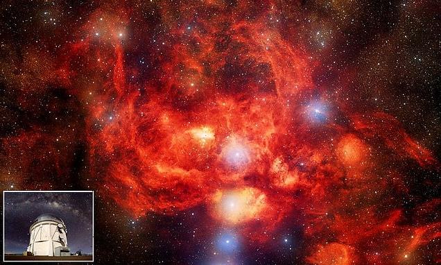 'Lobster Nebula' star-forming region glows bright red in stunning pic