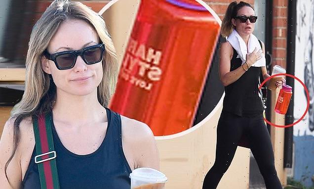 Olivia Wilde holds a Harry Styles water bottle in LA