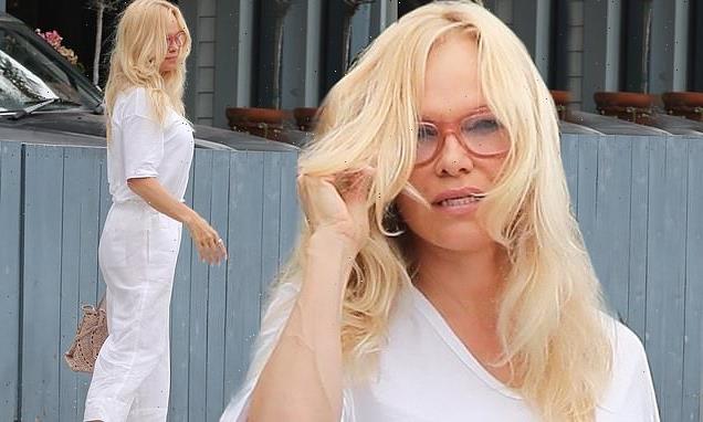 Pamela Anderson steps out wearing a white jumpsuit and trendy Crocs